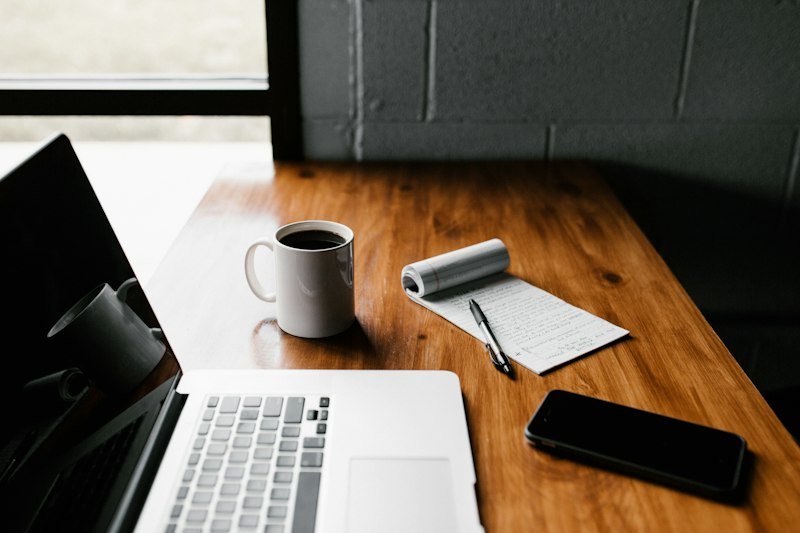Minimalist workspace with notebook and camera
